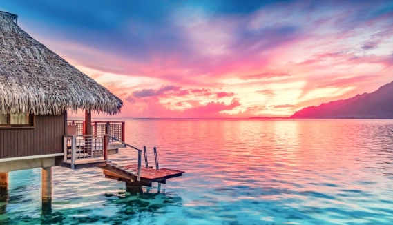 Chalet on water with sunset 
